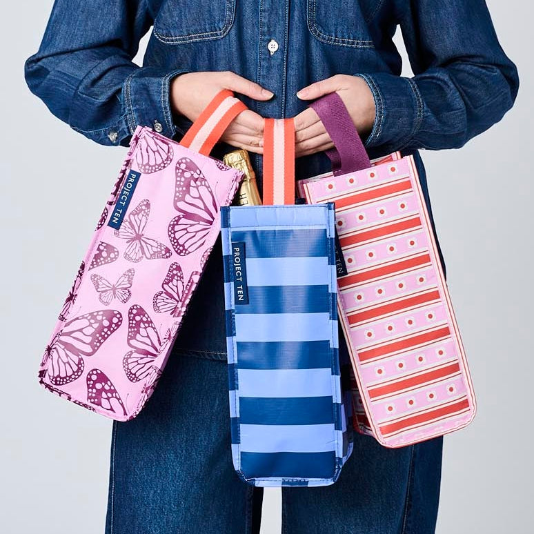 Someone holding 3 Wine Bags.
Butterfly, Blue Stripe & Wallpaper.
- Project Ten