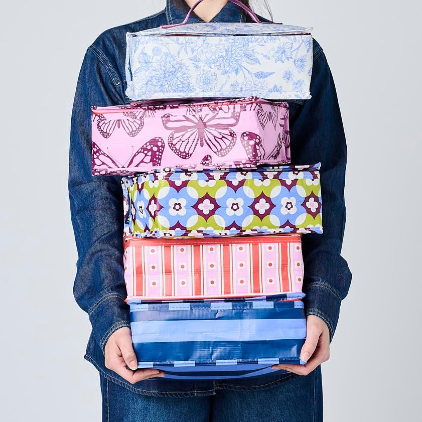 Someone holding 5 Takeaway Bags in Wallpaper, Butterfly, Toile, Mosaic & Blue Stripe.
- Project Ten
