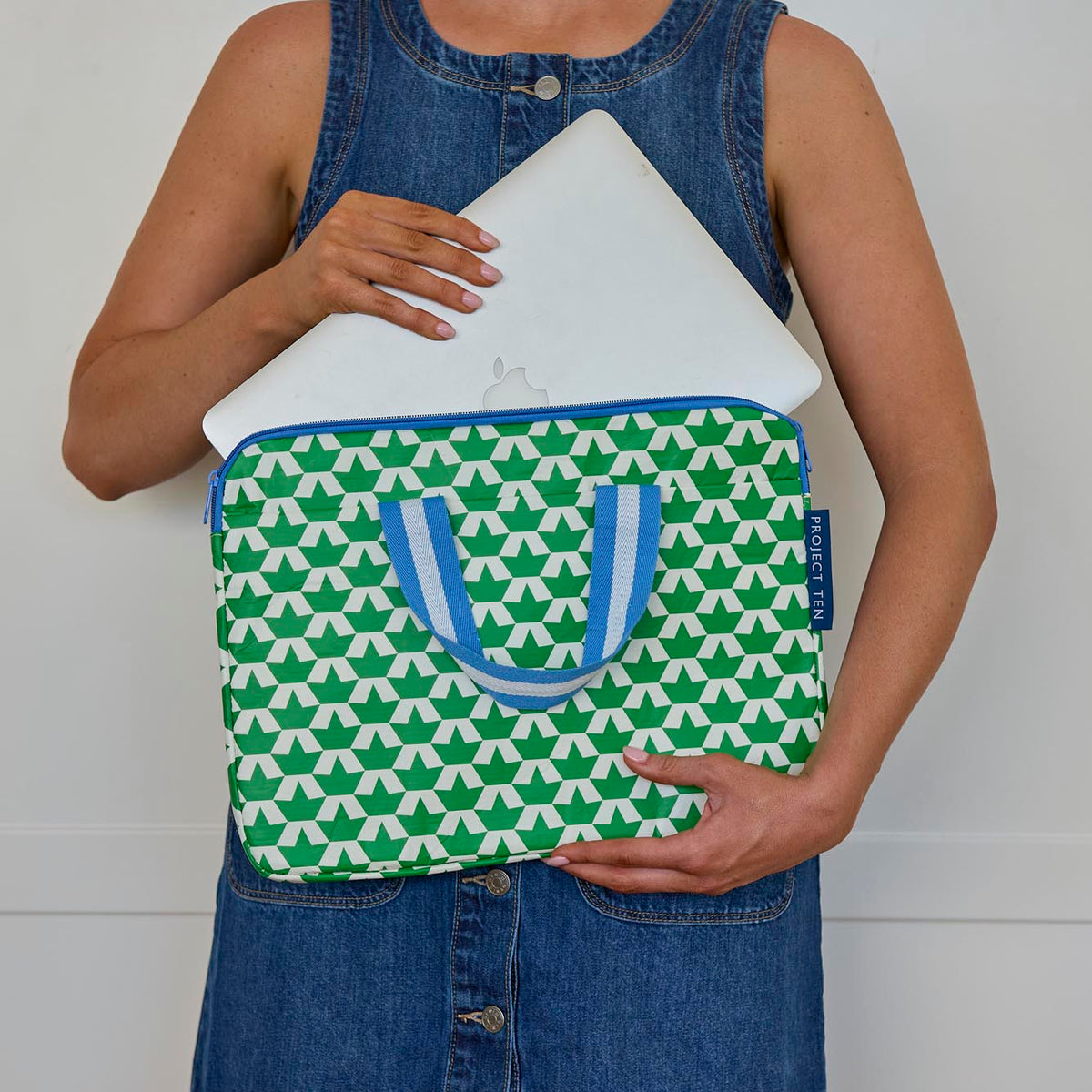 Someone placing a laptop into the Laptop Case – Boats - Project Ten