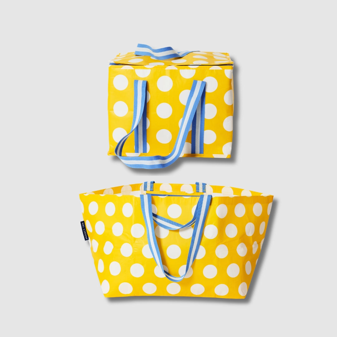 Our Yellow Polka Dot Beach Large Shopping Bundle, a zip-top Large Insulated Tote and Oversized Tote in bright yellow with large ecru polka dots, each with blue and ecru striped carry handles.