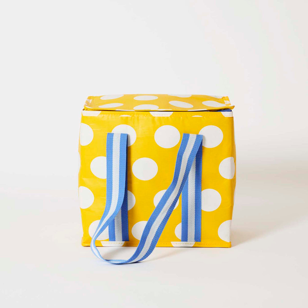 Our Yellow Polka Dot Medium Insulated Tote, a bright yellow with ecru polka dots, a fold-over zip lid and long blue and ecru striped straps.