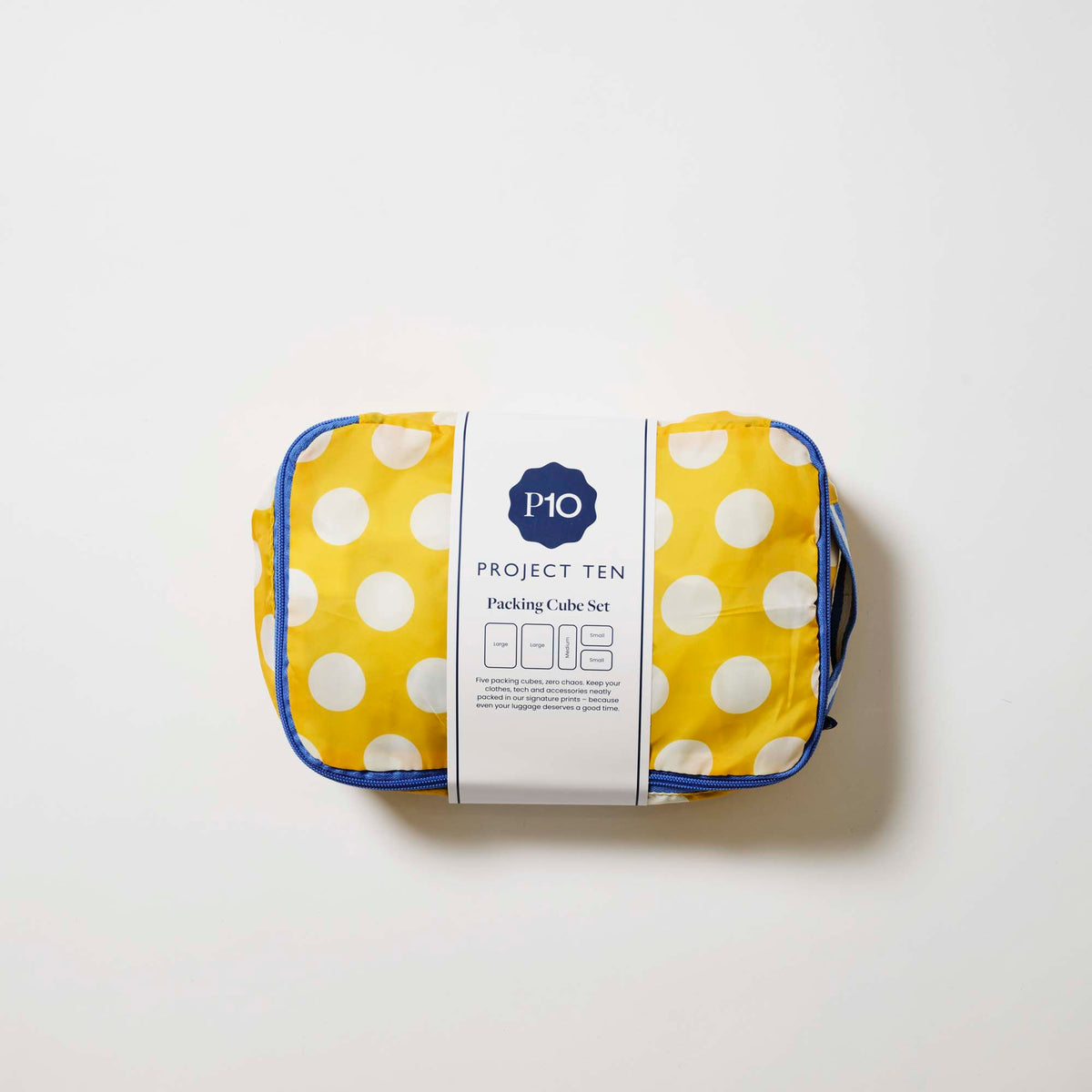 Our Yellow Polka Dot Packing Cubes, a set of five zip-up packing cubes in different sizes, in bright yellow with large ecru polka dots, with blue zips and blue and ecru striped carry handles.