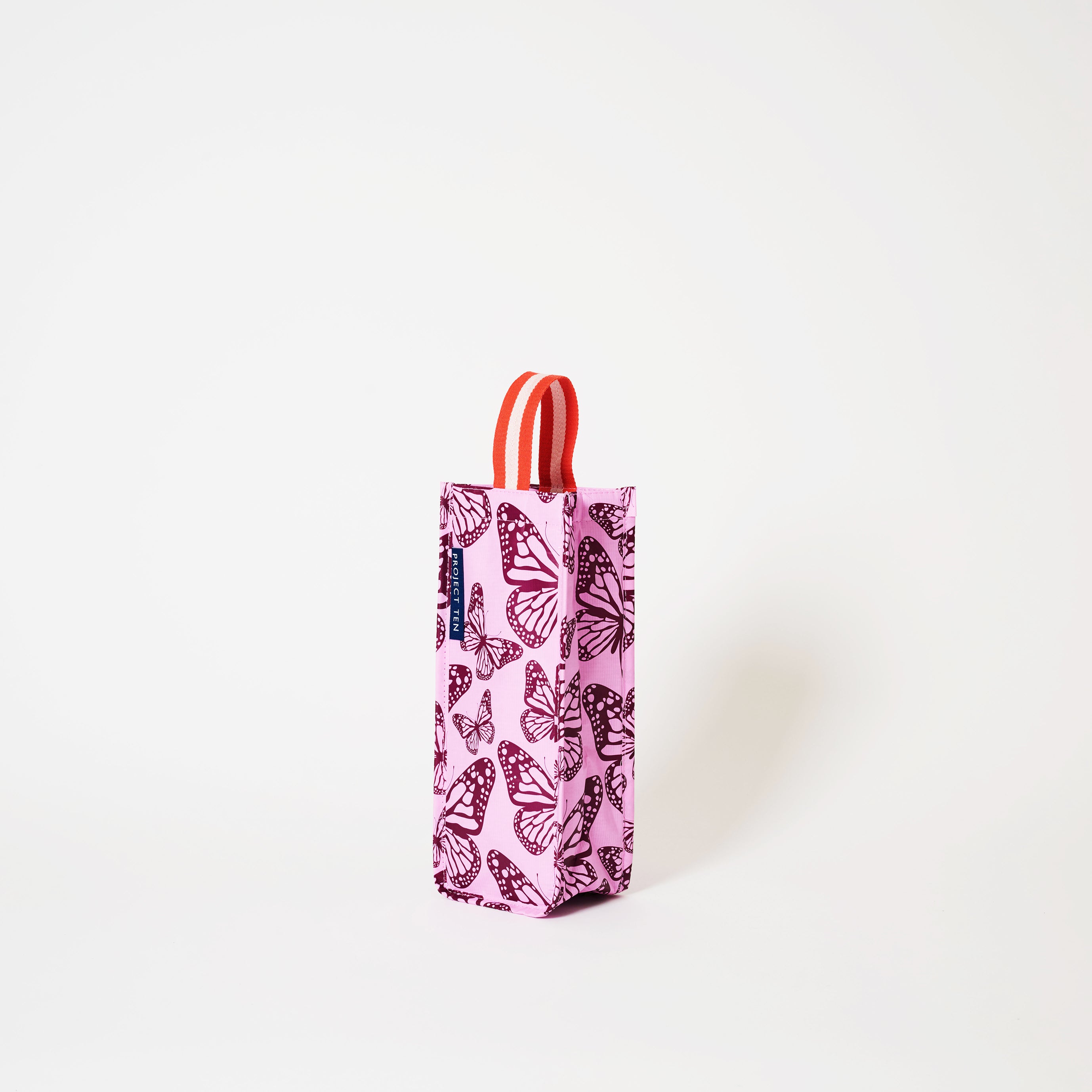 Wine Bag with soft woven strap, in Butterfly.
- Project Ten