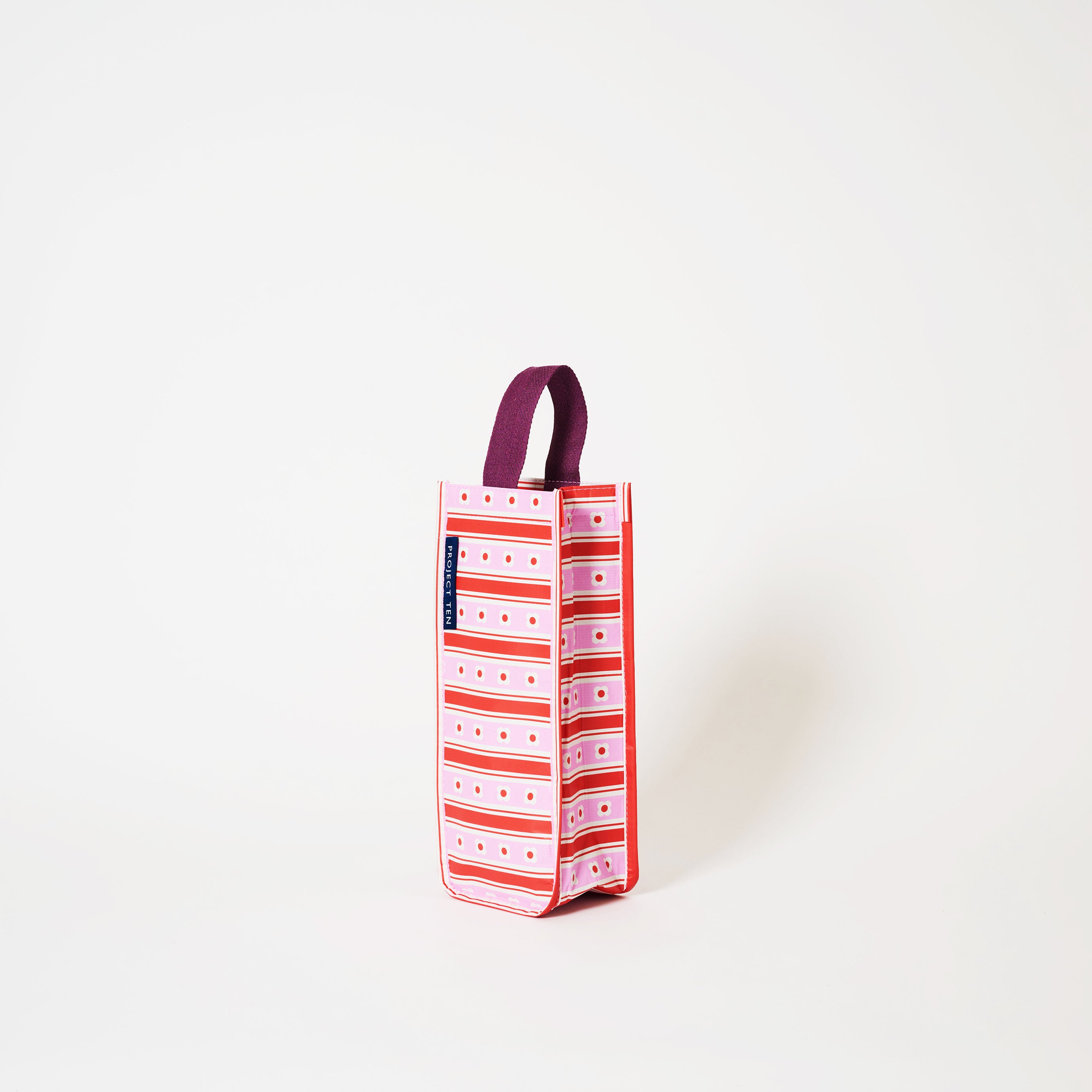 Wine Bag in Wallpaper with soft woven handle.
- Project Ten