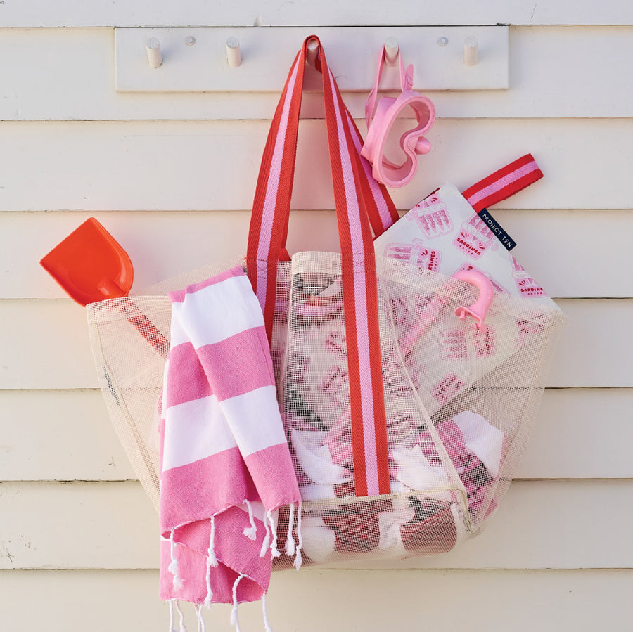 Mesh Oversized Tote with Large Zip Pouch and pool toys in it.
The bag is hanging using the shoulder straps.

- Project Ten