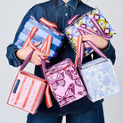 Someone holding 5 Mini Insulated Totes in Wallpaper, Butterfly, Toile, Mosaic & Blue Stripe. 
- Project Ten