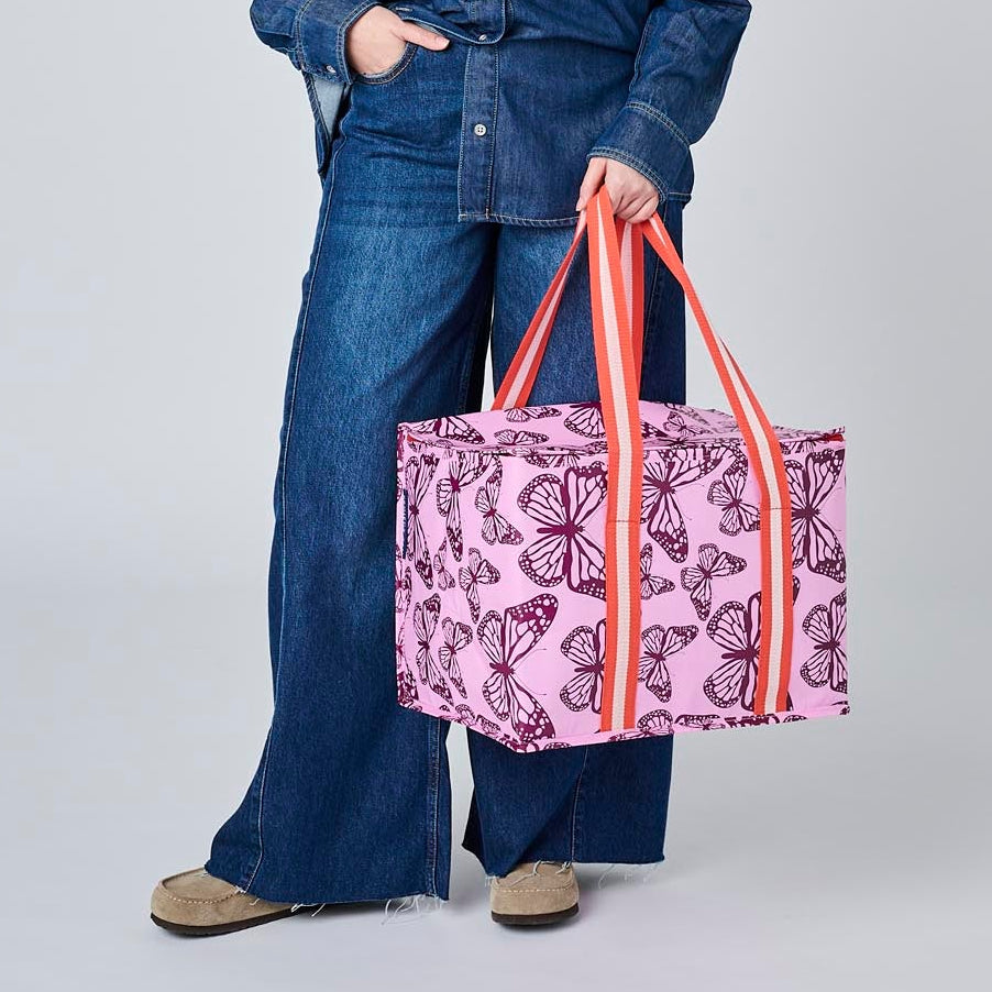 Someone holding the Large Insulated Tote using the soft woven handles.
- Project Ten