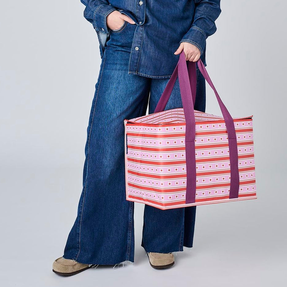Someone holding the Large Insulated Tote using the soft woven handles.
- Project Ten