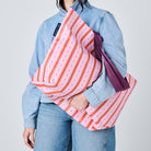 Someone holding the Medium Tote in Wallpaper. 
- Project Ten