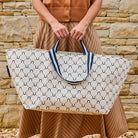 Someone holding the Oversized Tote – Navy Horseshoe - Project Ten