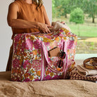 Someone placing something into the Overnight Bag – Hydrangea - Project Ten