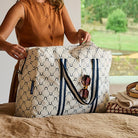 Someone zipping up the Overnight Bag – Navy Horseshoe - Project Ten