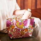 Someone placing a drink bottle in the Mini Tote – Hydrangea - Project Ten