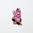 Double Glasses case in Butterfly. Image shows reading glasses sitting the top pocket and sunglasses resting on the case. 
- Project Ten