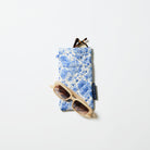 Double Glasses Case in Toile. A set of reading glasses sit in the top pocket and sunglasses are resting on the case. 
- Project Ten