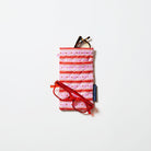 Double Glasses Case in Wallpaper pattern showing reading glasses in the top pocket and another set of reading glasses resting across the glasses holder. 