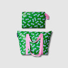 Our Sunglasses Large Zip Pouch and Zip Medium Tote Bundle, a Zip Medium Tote and a matching Large Zip Pouch in green with a scattered print of blue-lensed, white-framed sunglasses, with pink carry handles and a loop tab.