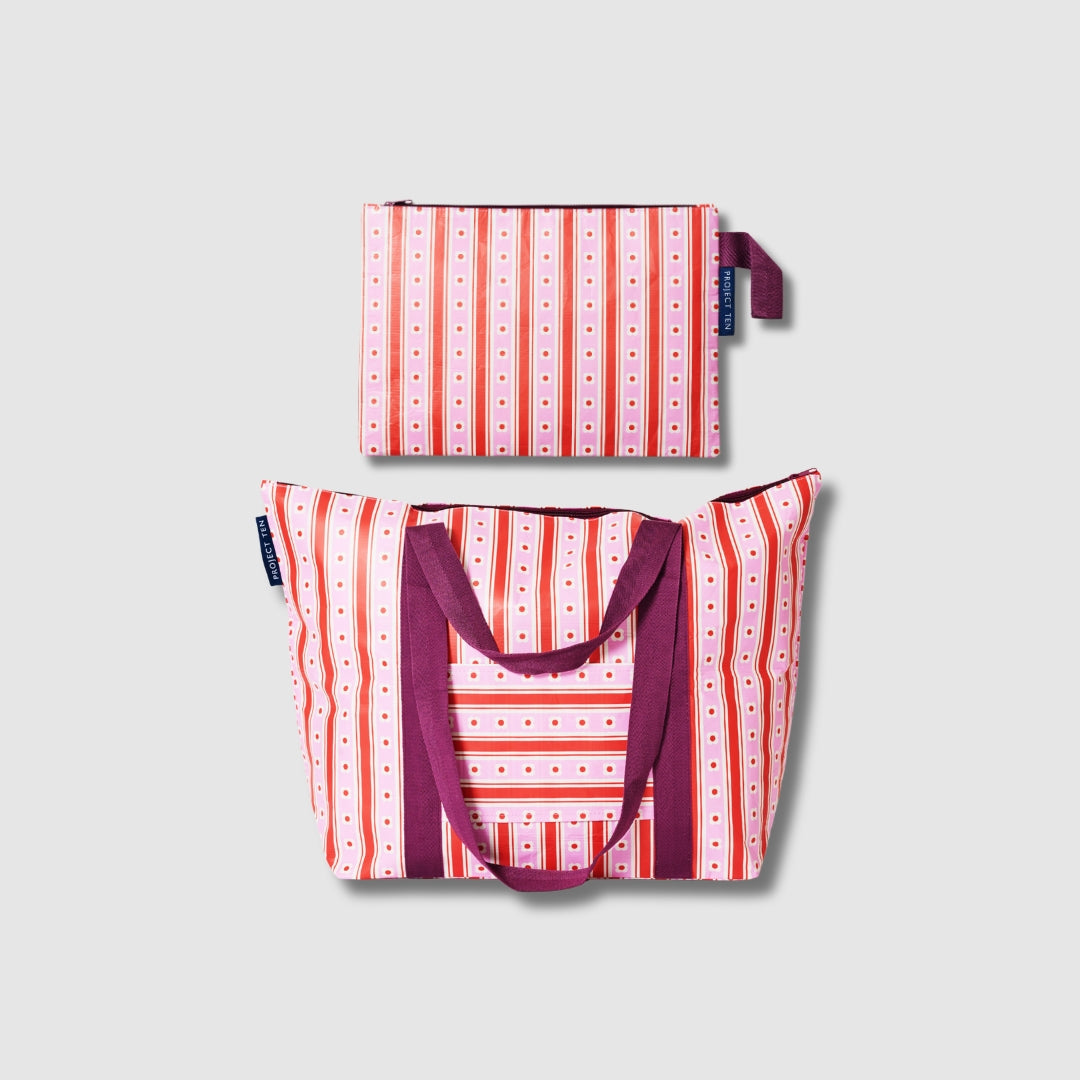 Image shows our Zip Medium Tote with luggage band below our Large Zip pouch, both in Wallpaper. 
- Project Ten