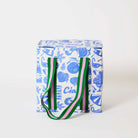 Feast Medium Insulated

Our Feast Medium Insulated Tote, in a blue and ecru print of lemons, seafood, gelato, soda bottles, sunglasses, beach umbrellas and the word "Ciao", with a fold-over zip lid and long green and pink striped straps.