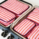 5 Wallpaper Packing cubes packed in a suitcase.
- Project Ten