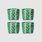 Our Sunglasses Shopper Tote Bundle, a set of four Shopper Totes in green with a scattered print of blue-lensed, white-framed sunglasses, each with pink carry handles.