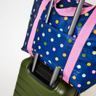 Zip Medium Tote – Confetti - Project Ten
Bag features a luggage strap so the bag can easily hook on to your suitcase