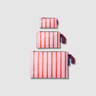 Three pouches. Large Zip Pouch, Mini Zip Pouch & Tiny Zip Pouch all in Wallpaper pattern. 

- Project Ten