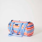 Our Capri Stripe Barrel Bag, a cylindrical duffle-style bag in pink, orange, blue and ecru horizontal stripes, with two blue and ecru striped carry handles, a detachable matching shoulder strap and a blue zip.