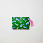 Our Sunglasses Mini Zip Pouch, a small rectangular pouch in green with a scattered print of ecru framed sunglasses with blue lenses, and a pink zip and handle.