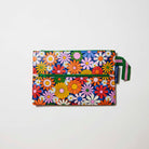 Our Coastal Floral Pencil Case, a flat rectangular case covered in bright retro daisies in orange, pink, yellow and blue on a navy background, with two green zip compartments and a green and pink striped handle.