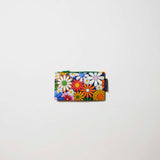 Coastal Floral Tiny Zip Pouch

Our Coastal Floral Tiny Zip Pouch, a small flat pouch covered in bright retro daisies in orange, pink, yellow and blue on a navy background, with a green zip.