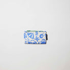 Our Feast Tiny Zip Pouch, a small flat pouch in a blue and ecru print of beach umbrellas, sunglasses, shrimp, starfish and fish, with a green zip.