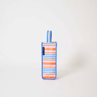 Our Capri Stripe Wine Bag, a tall narrow bottle bag in pink, orange, blue and ecru horizontal stripes with a blue trim and a single blue and ecru striped carry handle.