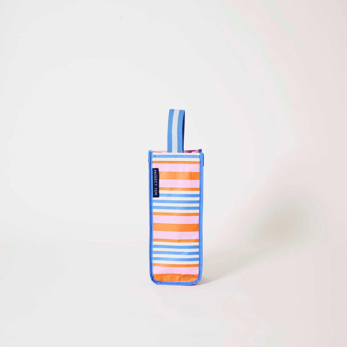 Our Capri Stripe Wine Bag, a tall narrow bottle bag in pink, orange, blue and ecru horizontal stripes with a blue trim and a single blue and ecru striped carry handle.