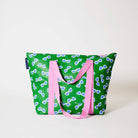 Our Sunglasses Zip Medium Tote in green with a scattered print of ecru framed sunglasses with blue lenses, with a full zip closure across the top and long pink shoulder straps.