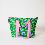 Our Sunglasses Zip Medium Tote in green with a scattered print of ecru framed sunglasses with blue lenses, with a full zip closure across the top and long pink shoulder straps.